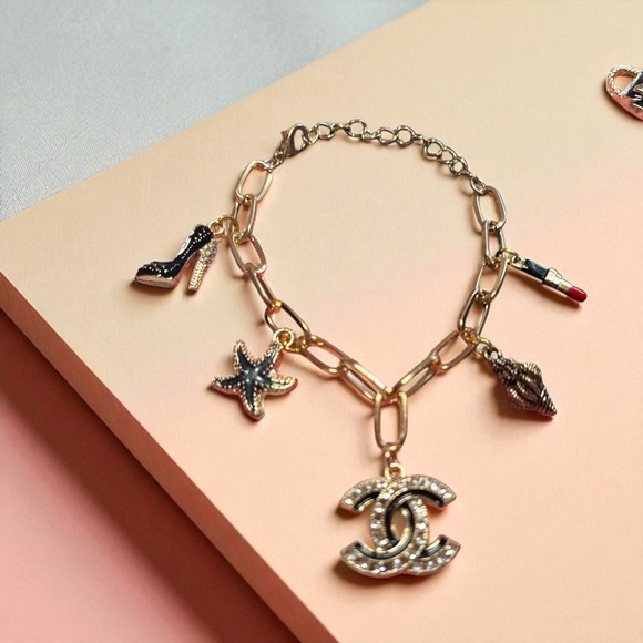Chanel Gold and Black charm bracelet - Picture 1 of 4